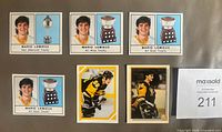Front view of six Mario Lemieux stickers showing player images and trophies