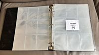 Binder opened showing clear 9-pocket pages
