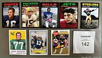 Front view of all eight football trading cards