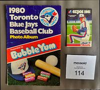Front covers of Blue Jays photo album and Expos pocket schedule
