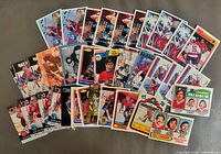 Fanned layout of entire 36-card lot showing variety of years and players