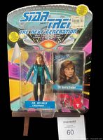 Front view of sealed Dr. Beverly Crusher figure on backing card