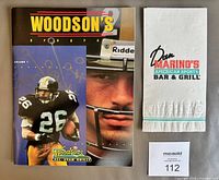 Front cover of Rod Woodson program and Dan Marino napkin