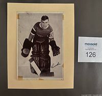 Front view of vintage Wilfred Cude Crown Brand hockey photo on beige mount