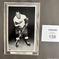 Front view of Gordie Howe Beehive photo showing image, border, nameplate
