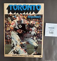 Front cover showing title TORONTO Argonauts and action photo