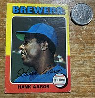 Front of 1975 O-Pee-Chee Hank Aaron card with coin for scale