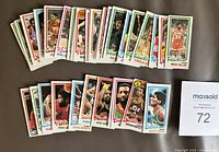 Spread of 38 detached 1980-81 Topps basketball cards showing fronts