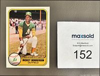 Front of 1981 Fleer Rickey Henderson baseball card #574 next to lot slip