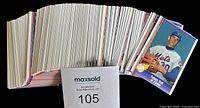 Stack of approximately 110 trading cards with Nolan Ryan card visible