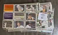 Stack of binder pages showing base set cards front and back