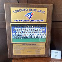 Full view of wooden plaque showing logo, team photo, roster text and overall condition