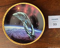Front view showing Romulan Warbird artwork and gold border