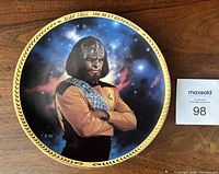 Front view of plate showing Lieutenant Worf image, gold border, clear condition