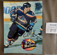 Front view of signed Kirk Muller glossy page showing signature and team uniform