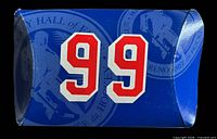Front of blue paper sleeve with large red 99 and Hockey Hall of Fame background graphic