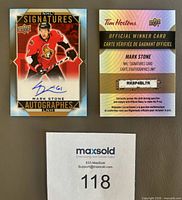 Front view of autographed Mark Stone card and accompanying winner card