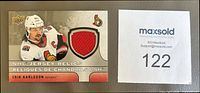 Front of Erik Karlsson Jersey Relics card showing player image, red jersey swatch and card details