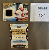 Front view of Josh Norris Jersey Relics card showing jersey swatch and winner card
