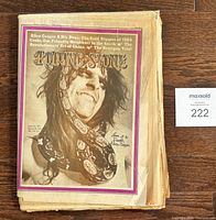 Front cover showing Alice Cooper with boa constrictor and lot identification card