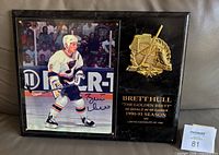 Front view showing signed photograph, gold relief, edition text