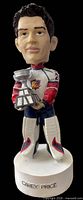 Front view of Carey Price bobblehead showing uniform, trophy and base text
