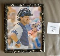 Full view of framed autographed Ernie Whitt print with MaxSold lot card