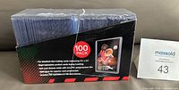 Front and side of sealed Ultra Pro 100-pack toploader box