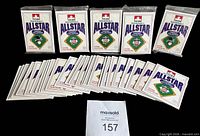Fronts of six sealed packs and twenty-five loose 1991 Petro-Canada All Star FanFest cards displayed