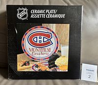 Front of sealed retail box showing Montreal Canadiens ceramic plate image and NHL branding