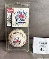 Front view of sealed Rawlings baseball package showing logo and product card