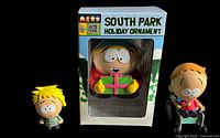 Front view showing sealed Eric Cartman ornament box flanked by Tweek Tweak and Timmy Burch miniature figures