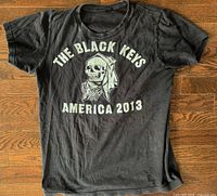 Front view of black 2013 The Black Keys tour T-shirt showing graphic and wear