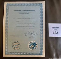 Full view of Toronto Blue Jays honorary souvenir contract showing border, text, Pat Gillick facsimile autograph and team logo