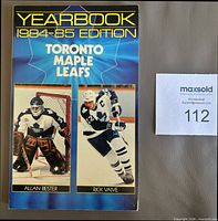 Front cover showing title, season, player photos