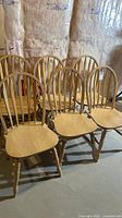 Six matching Ercol Windsor spindle back chairs front and side view