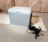 Coleman cooler front and side view with power adapter