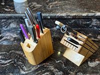 Both knife blocks with knives, honing rod and shears visible