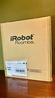 Sealed outer cardboard box labeled iRobot Roomba