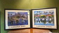 Both framed Lahaina posters side by side on table