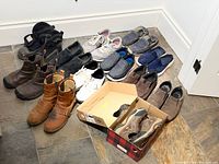 All nine pairs of shoes lined up on floor