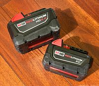 Both Milwaukee M18 REDLITHIUM battery packs, HD 9.0Ah and XC 3.0Ah, side by side