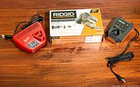 RIDGID boxed screwdriver kit with RIDGID and Milwaukee chargers