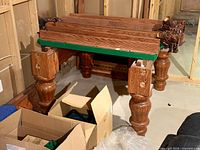 Oak pedestal legs, frame and rail sections stacked