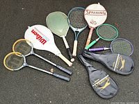 All rackets and covers arranged on ground