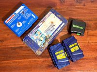 Five closed cases: Lenox hole cutter kit, metal socket set case, Hilmor case, two Irwin cases