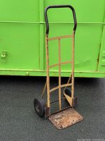 Full view of steel hand truck showing frame, wheels and toe plate