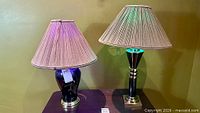 Both lamps side by side showing shades and colour-cycling bulbs