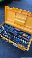 Tool chest open showing lift-out tray with assorted hand tools
