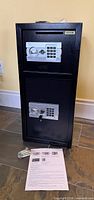 Front view of VEVOR two-tier safe showing both keypad doors and accessories